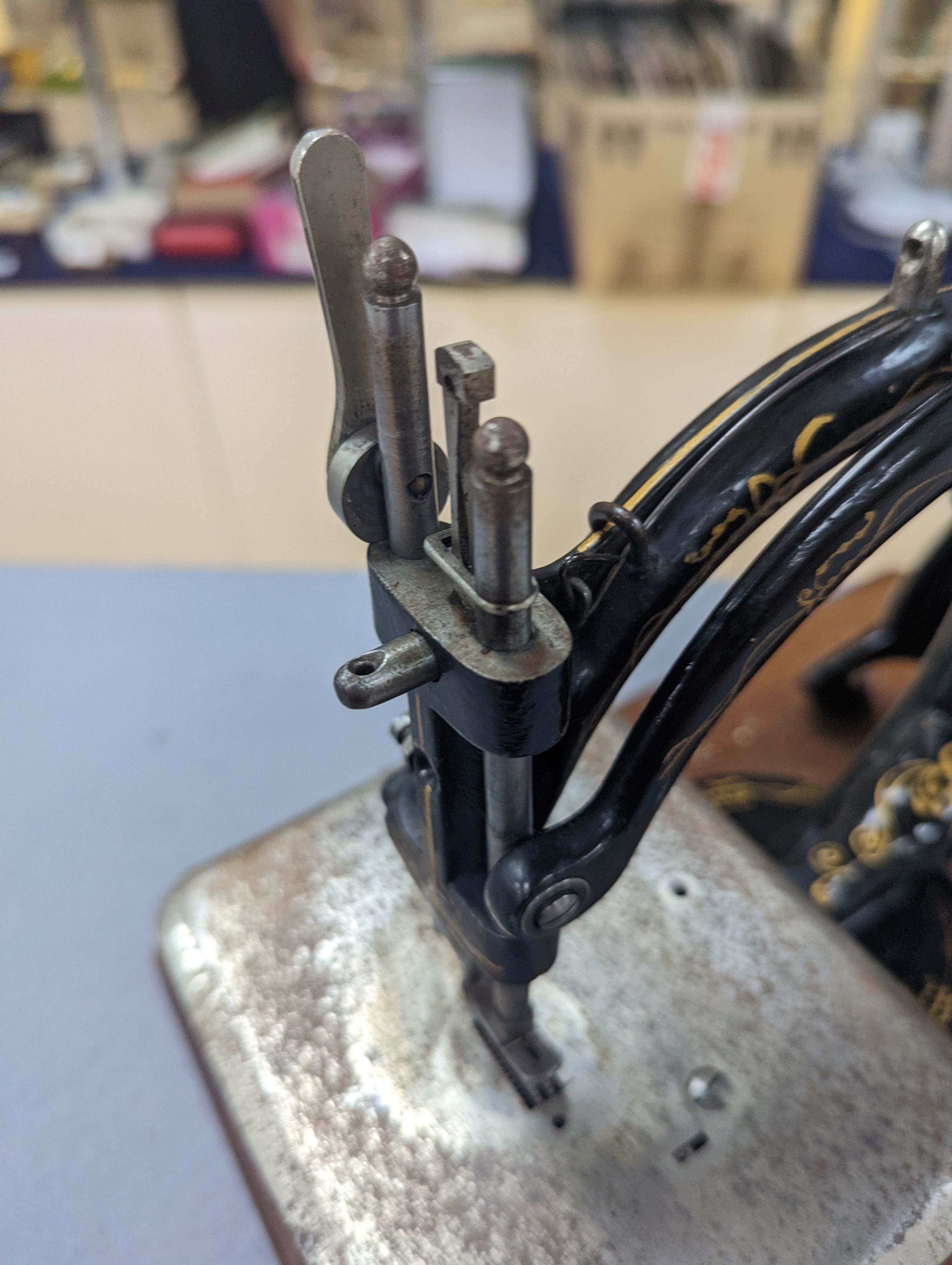 A Victorian sewing machine, Corona typewriter and two microscopes